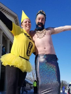 Colleen and Eric pause for a photo in 2022 before going in the water.