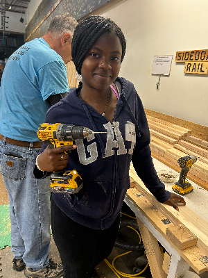 Picture of me volunteering at Sleep in Heavenly Peace! I helped create bed frames that will later turn into beds for children in need of them.