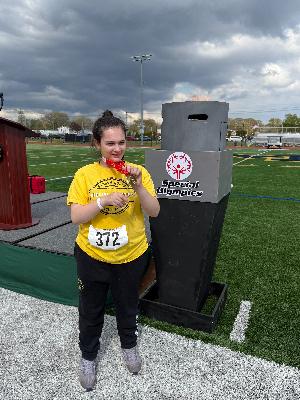 Bella with the Olympic flame after winning �'�'